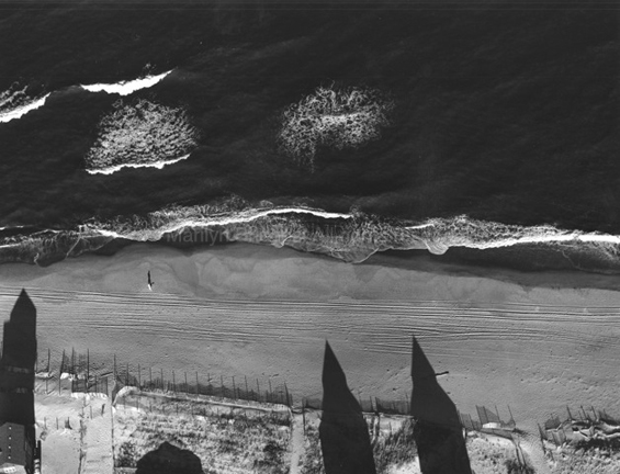 Strolling on the Beach, Ocracoke Island, North Carolina, 1993. USA South. copyright photographer Marilyn Bridges.