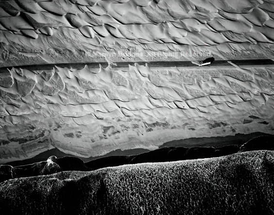 Dunes and Truck, Pan American Highway, Chala, Peru, 1989. Latin America. copyright photographer Marilyn Bridges